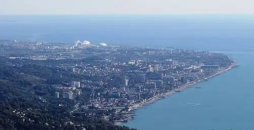 The coastal resort of Adler as seen from the Mount Akhun, 9 kilometres (5.6&nbsp;mi) to the northwest