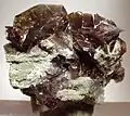 Clove-brown axinite crystals to 2.3&nbsp;cm set atop matrix from the West Bor Pit at Dalnegorsk, Russia