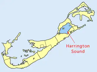 Map of Bermuda, with the island stretching from the top right corner to the bottom left corner of the image. A a large body of water in the middle of the island is labeled as Harrington Sound.