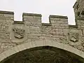 Bodelwyddan Castle, Williams Arms over archway towards gardens.