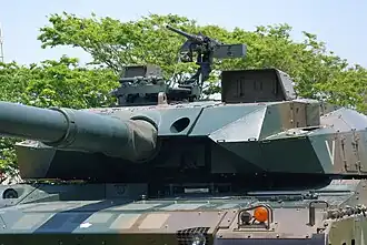 Front closeup of turret showing sensor package and M2 Browning .50 caliber