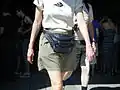 A woman wearing a leather fanny pack