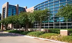 The entrance of a building with a glass front.