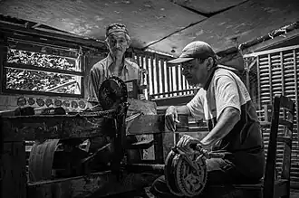 The stage of winding the weaving threads into a place where the spools of thread function as thread for the length of the songket cloth in Sumatra