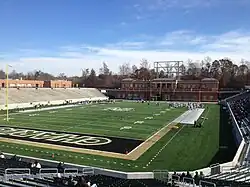 A photograph of a stadium in early stages of construction