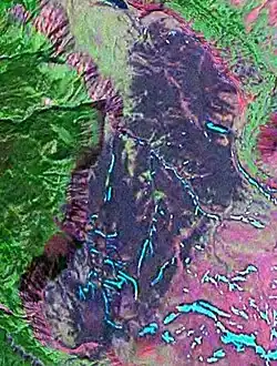 An overhead view of the edge of a cliff-bounded plateau.