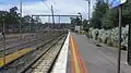 Northbound view from the station platform, with a derailed X'Trapolis train visible in the distance, November 2015