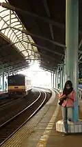 A passenger waiting at the station platform