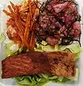 Side dish of taegu (cod) with poke and fried salmon mixed plate