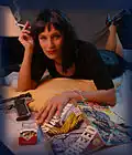 In the 1990s, crime and spy comedy films were extremely popular, such as Pulp Fiction (depicted), L.A. Confidential, New Jack City, Boyz n the Hood, Menace II Society, Goodfellas, and the Austin Powers film series.