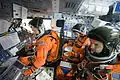 Crew of STS-135 inside Space Shuttle mock-up during training (Pictured (L to R): Doug Hurley, Sandra Magnus, and Rex Walheim)