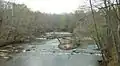 The Saugahatchee Creek, which runs through the area, serves as a popular swimming hole for locals during spring and summer months.