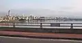 Taipei Bridge in 2008 Photo is of the eastbound motorcycle/bicycle/pedestrian bridge looking south with a sign marking the border between Taipei City, a special municipality, and Taipei County in Taiwan Province (now New Taipei City)