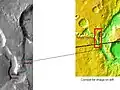 The long channel Nirgal Vallis is shown where it connects to Uzboi Vallis. The crater Luki is 21&nbsp;km in diameter.