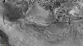 Dunes and old glaciers in Renaudot Crater, as seen by CTX camera (on Mars Reconnaissance Orbiter). Arrows point to old glaciers along the crater wall.