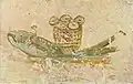 Loaves of bread and fish (symbols of the Eucharist)
