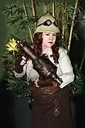 Woman wearing Neo-Victorian steampunk costume, including goggles and pith helmet, 2010.
